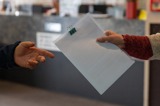 handing over a document