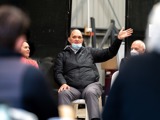 Person speaking in front of group