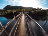 Person walking on a swingbridge