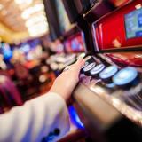 Hand on gambling machine