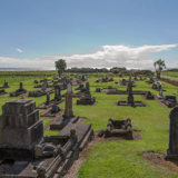 Graves at a cemetery in the sunshine