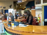 Person at counter in an information centre