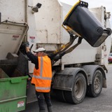 recycling truck picking up bin